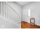 Inviting foyer with hardwood floors, a staircase with white railing, and a bright white front door at 12832 Broncos Dr, Fishers, IN 46037