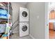 This laundry room features a stacked washer and dryer unit and extra storage at 12832 Broncos Dr, Fishers, IN 46037