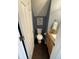 Charming powder room with blue walls and wood flooring, perfect for guests at 1304 Crescent Dr, Greenwood, IN 46143