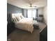 Bright bedroom with a large bed, desk, and neutral tones for a peaceful retreat at 1304 Crescent Dr, Greenwood, IN 46143