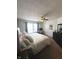Inviting bedroom features a ceiling fan, desk area, and lots of natural light at 1304 Crescent Dr, Greenwood, IN 46143