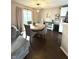 Open concept dining room with a round table, modern light fixture, and sliding glass doors at 1304 Crescent Dr, Greenwood, IN 46143