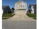 Inviting two-story house featuring neutral siding and a spacious two-car garage at 1304 Crescent Dr, Greenwood, IN 46143