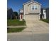 Charming two-story home with a two car garage and well-maintained lawn at 1304 Crescent Dr, Greenwood, IN 46143