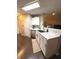 Well-lit kitchen features white cabinets, stainless steel appliances, and a modern countertop at 1304 Crescent Dr, Greenwood, IN 46143