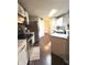 Modern kitchen featuring white cabinets, stainless steel appliances, and marble countertops at 1304 Crescent Dr, Greenwood, IN 46143
