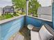 Cozy balcony with wicker furniture and a view of the neighborhood street at 1409 Spann Ave, Indianapolis, IN 46203