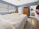Comfortable bedroom featuring a large window, neutral color palette, and access to an ensuite bathroom at 1409 Spann Ave, Indianapolis, IN 46203