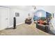 Bright living room featuring plush seating and a mounted projector for entertainment at 1409 Spann Ave, Indianapolis, IN 46203