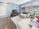 Bright living room with hardwood floors, a comfortable sectional, and large windows at 1409 Spann Ave, Indianapolis, IN 46203