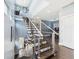 Staircase with wooden steps and a modern railing leads to the upper level at 1409 Spann Ave, Indianapolis, IN 46203