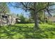 Backyard with a large shade tree at 1515 S Emerson Ave, Indianapolis, IN 46203
