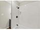 Updated bathroom showcasing a tiled shower with modern fixtures and a clean design at 1515 S Emerson Ave, Indianapolis, IN 46203
