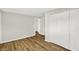 Bedroom with wood-look flooring, a large closet, and ample space at 1515 S Emerson Ave, Indianapolis, IN 46203