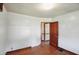 A simple bedroom with painted walls and wood-look floors at 1515 S Emerson Ave, Indianapolis, IN 46203