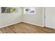 Cozy bedroom with hardwood floors and two windows providing natural light at 1515 S Emerson Ave, Indianapolis, IN 46203