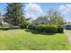 Charming single-story home with a spacious front lawn and mature landscaping at 1515 S Emerson Ave, Indianapolis, IN 46203