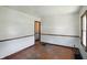 Bright living room with hardwood floors, white walls, and classic wood trim at 1515 S Emerson Ave, Indianapolis, IN 46203