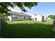 Backyard view showcasing lush green grass, privacy fence, and a convenient storage shed for outdoor equipment at 1652 Sweetwater Ln, Greenfield, IN 46140