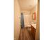 Neutral bathroom featuring a tub/shower combo, wood-look flooring, and a wooden medicine cabinet at 1652 Sweetwater Ln, Greenfield, IN 46140