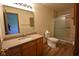 A bathroom with a single sink vanity, quartz countertop, and a glass shower enclosure at 1652 Sweetwater Ln, Greenfield, IN 46140