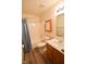 Bathroom with shower, vanity and updated flooring at 1652 Sweetwater Ln, Greenfield, IN 46140
