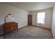 Carpeted bedroom with furniture, a window with blinds, and a neutral color palette at 1652 Sweetwater Ln, Greenfield, IN 46140