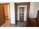 A closet with an organizer, open bi-fold doors, and a view into the carpeted bedroom at 1652 Sweetwater Ln, Greenfield, IN 46140