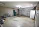 Spacious garage with ample storage and a large garage door for easy vehicle access, offering convenience at 1652 Sweetwater Ln, Greenfield, IN 46140