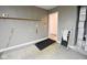 Functional garage space with shelving, a convenient access door and a ramp for easy entry at 1652 Sweetwater Ln, Greenfield, IN 46140
