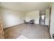 Bare living room with carpet and table with chairs at 1652 Sweetwater Ln, Greenfield, IN 46140