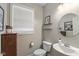 Powder room boasts elegant fixtures, a pedestal sink, and ample natural light from the window at 17002 Folly Brook Rd, Noblesville, IN 46060