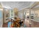 Elegant dining room features hardwood floors, a unique chandelier, and an open layout perfect for entertaining at 17002 Folly Brook Rd, Noblesville, IN 46060