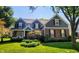 Charming two-story home featuring a manicured lawn, tasteful landscaping, and a welcoming front porch, perfect for suburban living at 17002 Folly Brook Rd, Noblesville, IN 46060