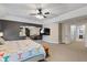 Primary bedroom with sitting area and a spacious layout, featuring neutral tones and plush carpet at 17002 Folly Brook Rd, Noblesville, IN 46060