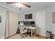 Modern home office featuring a large monitor display and standing desk at 17002 Folly Brook Rd, Noblesville, IN 46060