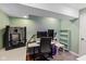 Modern basement office with a desk, gaming setup, comfortable chair, and ample space for productivity at 17002 Folly Brook Rd, Noblesville, IN 46060