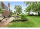 Back patio features outdoor seating and mature trees at 17002 Folly Brook Rd, Noblesville, IN 46060