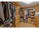 Spacious walk-in closet boasts built-in wooden shelves, drawers, and ample storage for clothes and accessories at 17002 Folly Brook Rd, Noblesville, IN 46060
