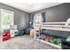 Playful bedroom featuring a bunk bed, toy kitchen, and plenty of play space at 1747 S Irvington Ave, Indianapolis, IN 46203