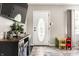 Bright and welcoming foyer with wood-look floors, front door with decorative glass insert, and a view of the living area at 1747 S Irvington Ave, Indianapolis, IN 46203