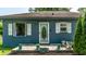 Charming single-story home with a welcoming front porch, beautiful landscaping, and great curb appeal at 1747 S Irvington Ave, Indianapolis, IN 46203