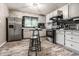 Well-equipped kitchen with stainless steel appliances, cabinetry, and a breakfast table set at 1747 S Irvington Ave, Indianapolis, IN 46203