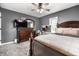 Comfortable bedroom with a wooden dresser, a mirror, and a well-lit vanity area at 1747 S Irvington Ave, Indianapolis, IN 46203