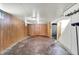 Spacious basement with stairs and wood paneling at 1852 N Warman Ave, Indianapolis, IN 46222