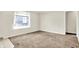 Bedroom featuring neutral walls, carpet flooring, and a window that provides natural light at 1852 N Warman Ave, Indianapolis, IN 46222