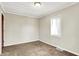 Bright bedroom with one window, neutral walls, and carpet flooring at 1852 N Warman Ave, Indianapolis, IN 46222