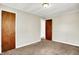 Bedroom with two doors, neutral walls, carpet flooring at 1852 N Warman Ave, Indianapolis, IN 46222
