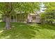 Enjoy a peaceful backyard with a wooden deck and abundant green space for outdoor activities at 1941 Orchard Ct, Carmel, IN 46280
