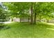 Well-maintained backyard with mature trees and lush lawn at 1941 Orchard Ct, Carmel, IN 46280